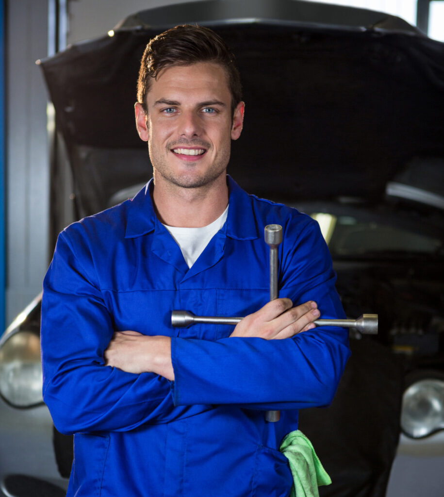 portrait of mechanic holding lung wrench